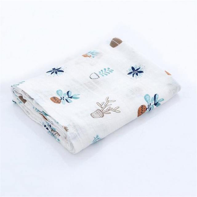 Stack of folded organic cotton baby muslin swaddle blankets, ideal as a thoughtful newborn gift