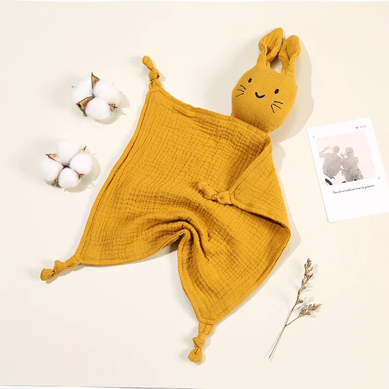 Machine washable organic cotton infant comfort blanket with integrated feline toy