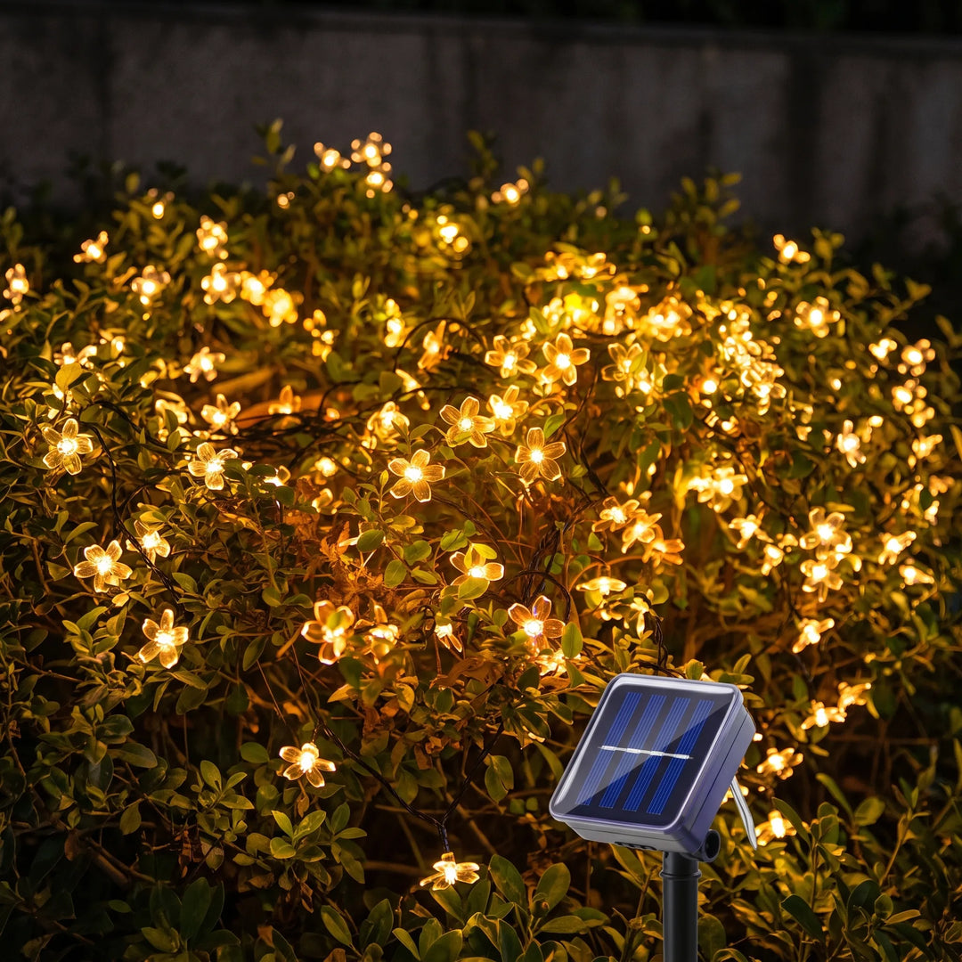 Outdoor solar blossom string lights for garden & patio decor. Waterproof LED ambiance lighting.