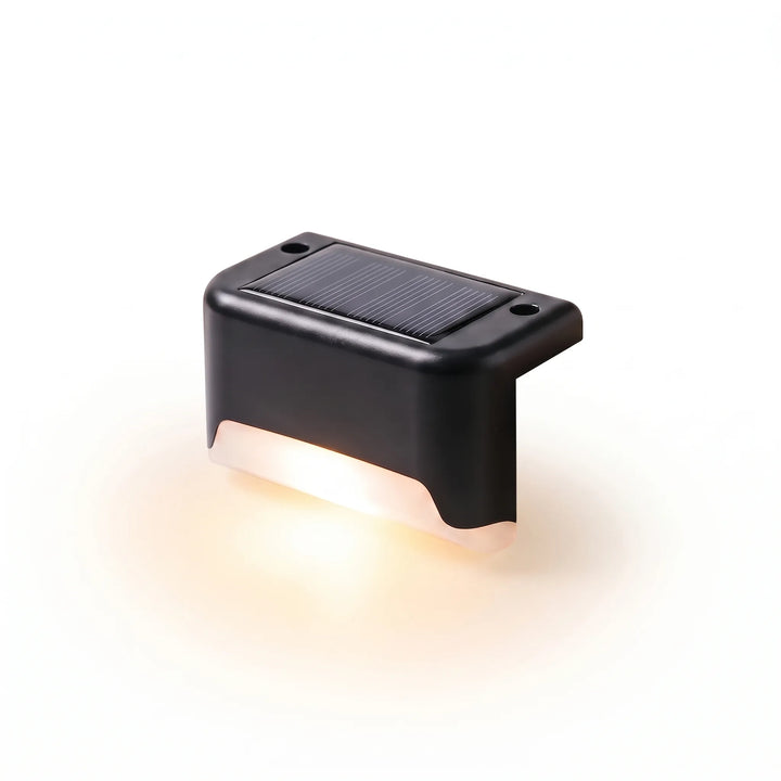 Wireless LED solar step lights casting a warm glow on outdoor stairs for safety and ambiance. Easy to install.