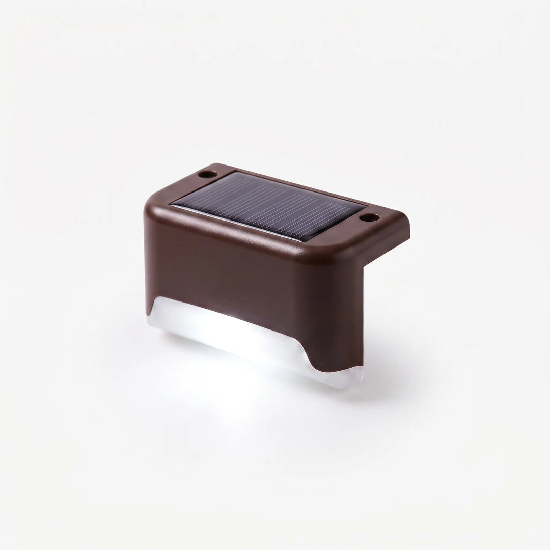 Set of solar outdoor lights enhancing garden paths, deck stairs, and patio fences. Eco-friendly LED landscape lighting.
