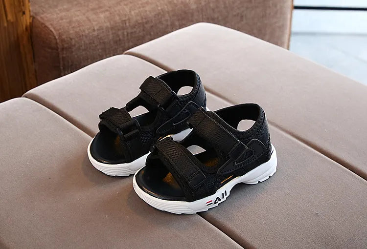 Lightweight children's sport sandals in grey, designed for active toddlers and summer adventures.