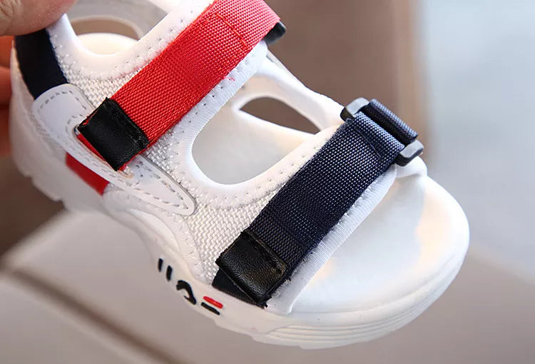 Children's sandals with soft footbed, promoting comfort for all-day wear and play.