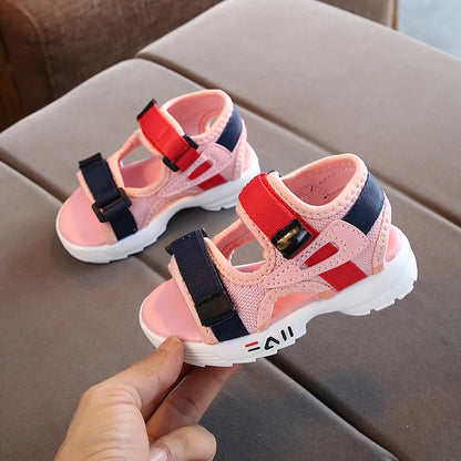 Kids' sport sandals with soft sole, showing flexible material for comfortable toddler movement and play.