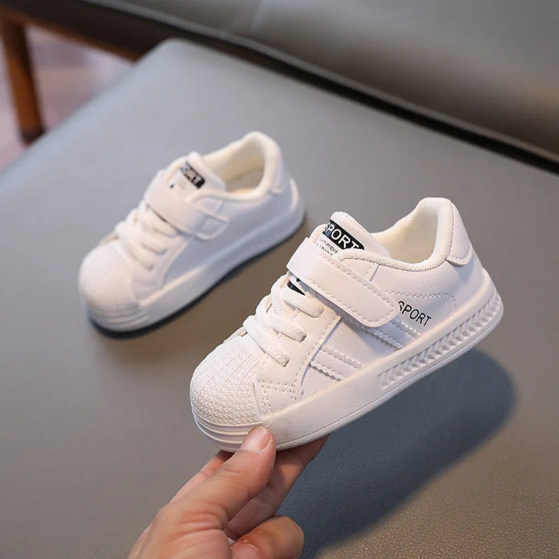 Children's anti-slip casual sneakers in white, perfect for active toddlers and playground play.