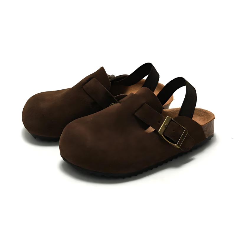 Toddler wearing unisex green adjustable comfort clogs, designed for easy slip-on play