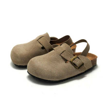 Side view of pink kids' adjustable comfort clogs, lightweight and durable for outdoor play