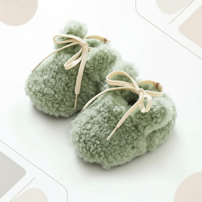 Baby's feet in non-slip booties, ensuring warmth and stability for early steps, cozy infant shoes.