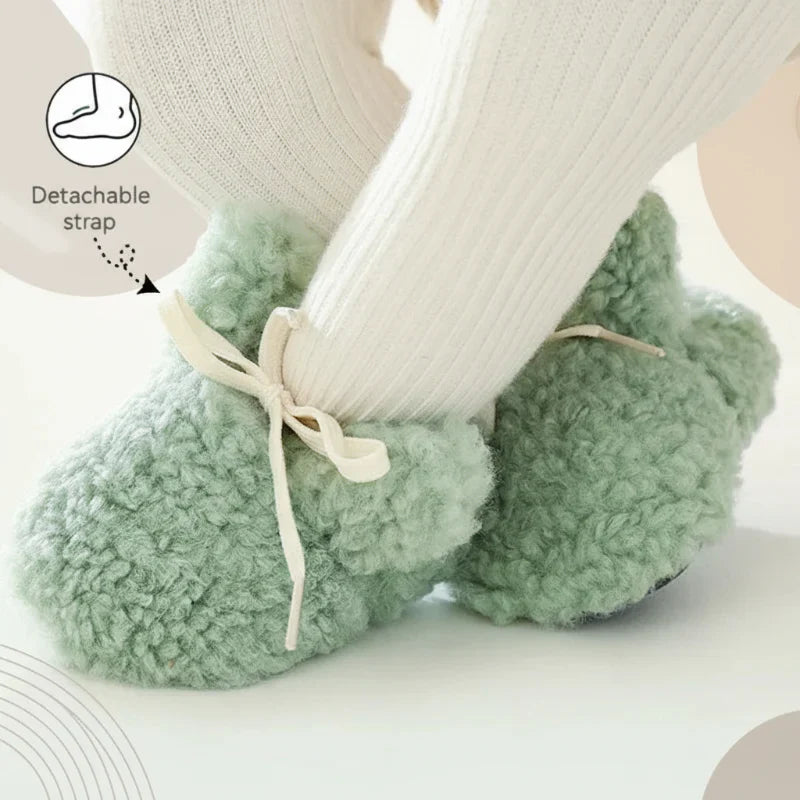 Detail of non-slip sole on cozy infant booties, perfect baby shoes for young children.