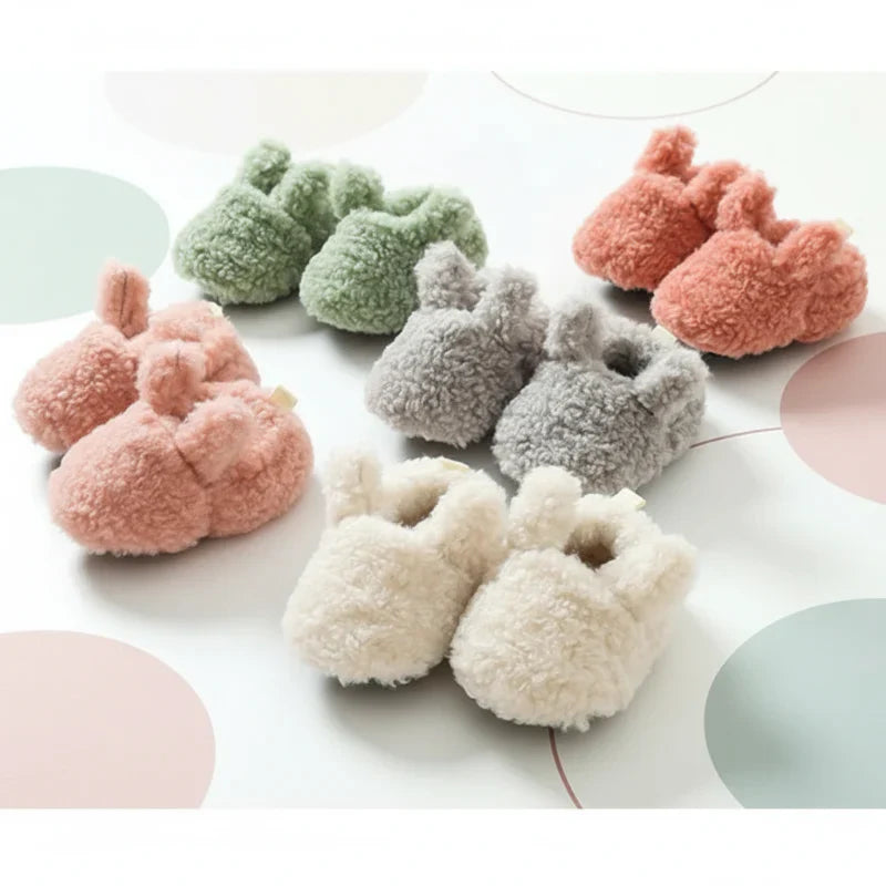 Cozy non-slip infant booties in a display, showing soft fabric and secure design.