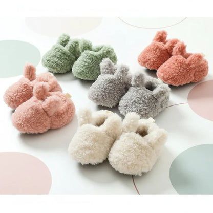 Cozy non-slip infant booties in a display, showing soft fabric and secure design.
