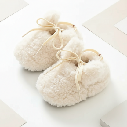 Collection of non-slip infant booties, various colors of cozy baby shoes.