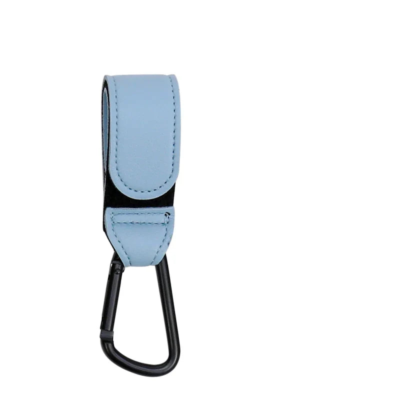 Overhead shot of a stroller with a neatly organized diaper bag hanging from PU hooks