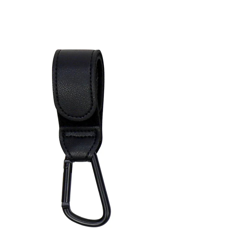 Detail of the 360-degree rotating mechanism on a black PU leather stroller hook