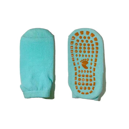 Promotional image showing the grip dots on the sole of an orange trampoline sock.
