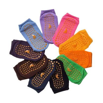 Unisex anti-slip trampoline sports socks in a variety of sizes, stacked neatly.