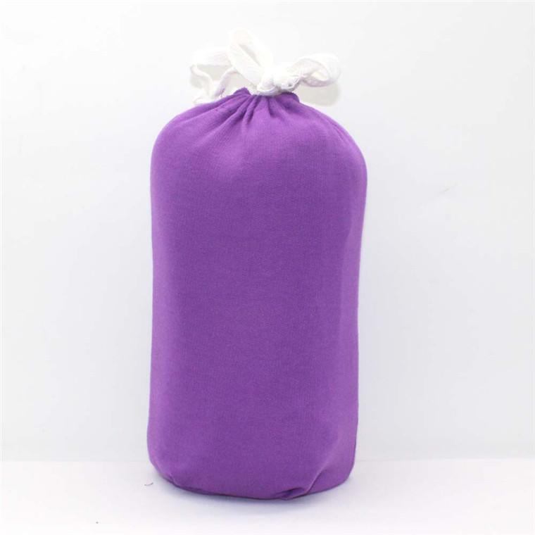 Organic cotton baby wrap carrier in a neutral color, ideal for newborn comfort and support.