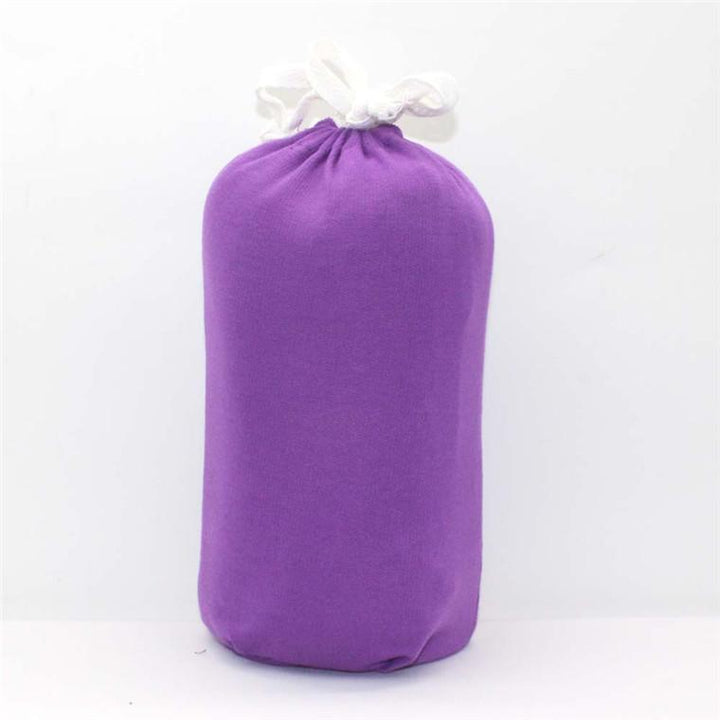 Organic cotton baby wrap carrier in a neutral color, ideal for newborn comfort and support.