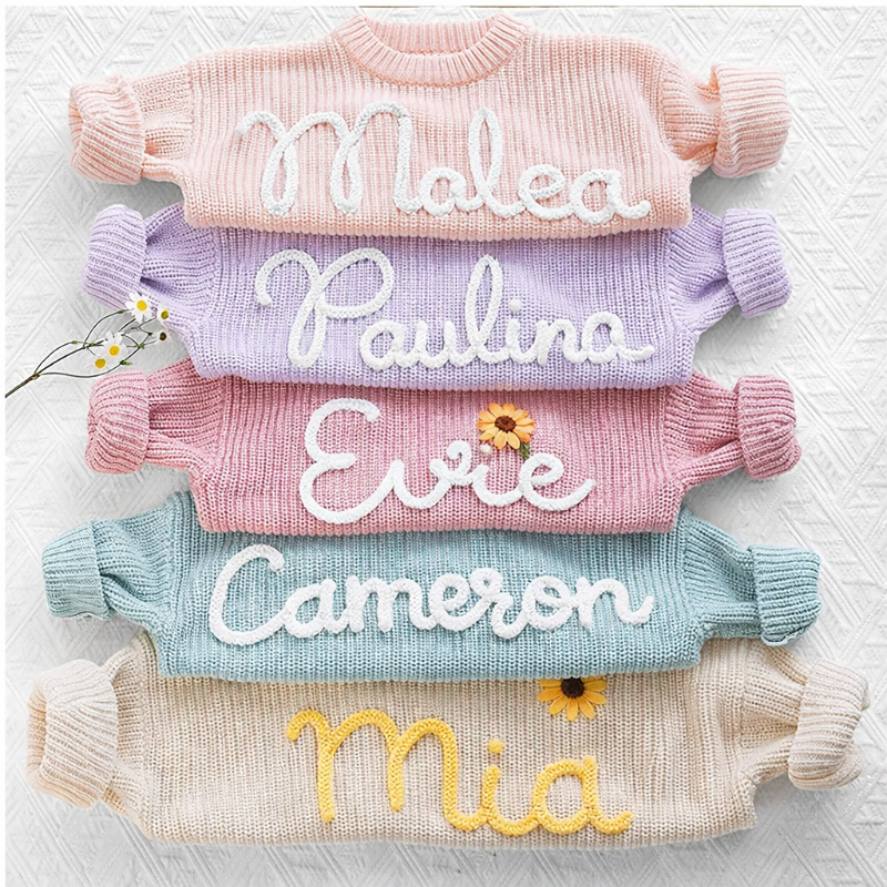 Children's personalized knit top featuring 'Emma' in red, comfortable cotton blend apparel.