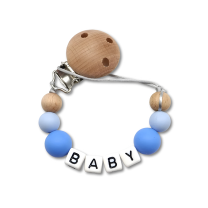 White personalized pacifier clip featuring 'Emma' for a thoughtful baby shower gift.