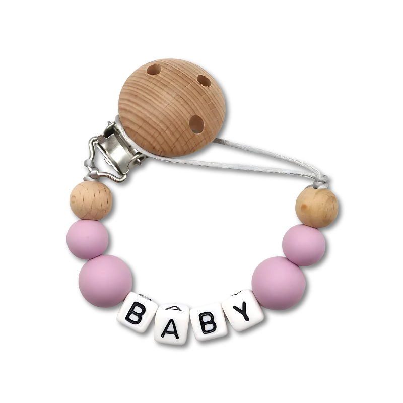 Close-up of a personalized baby pacifier clip with 'Liam' name, secure metal clip.