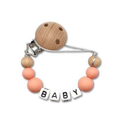 Baby pacifier clip with custom name 'Olivia', a practical and stylish crib accessory.