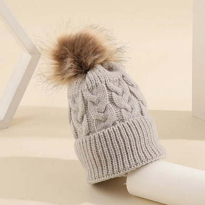 Girls' personalized knit pom pom beanie, a thoughtful and warm baby shower gift