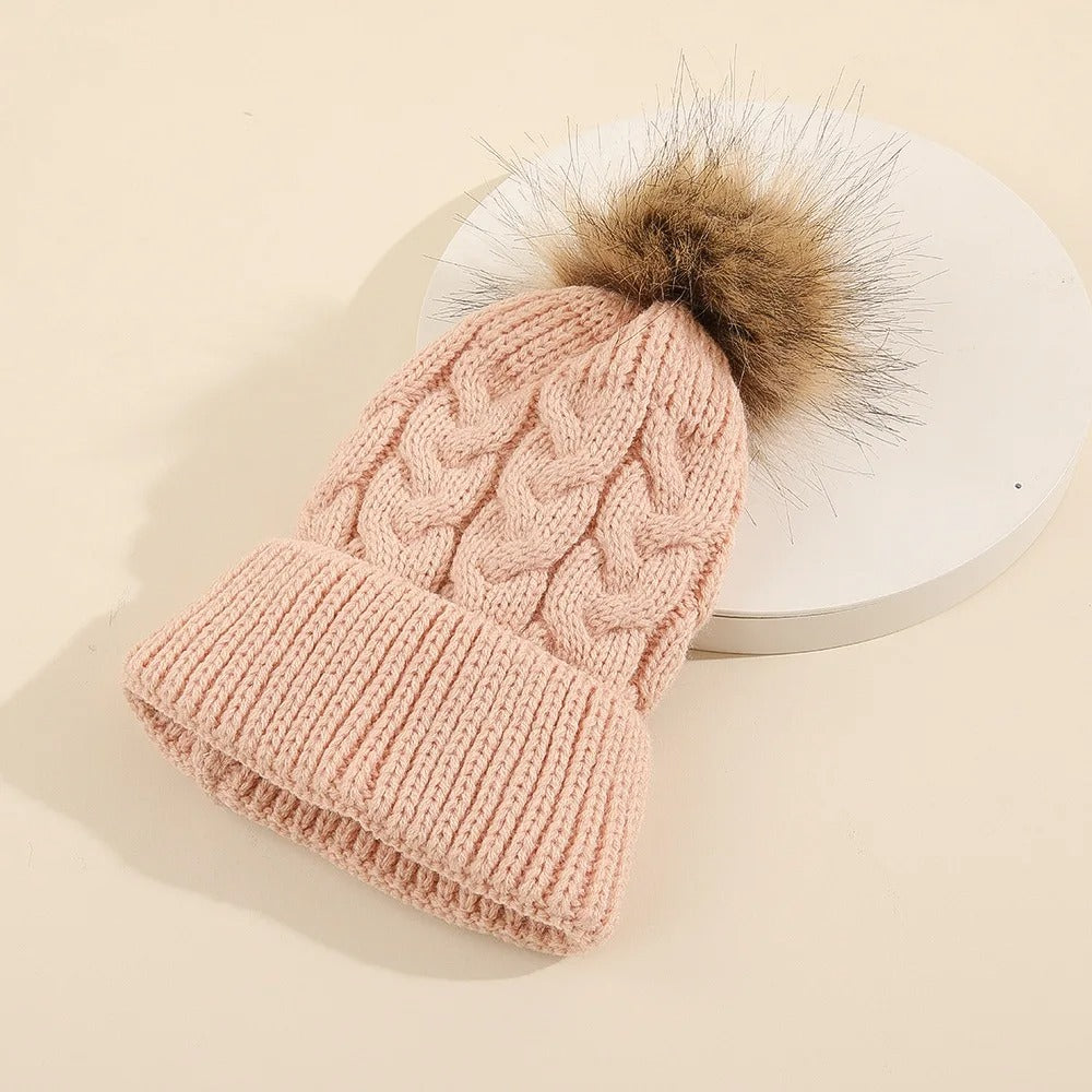 Comfortable personalized knit pom pom hat, essential for keeping baby girls warm in winter