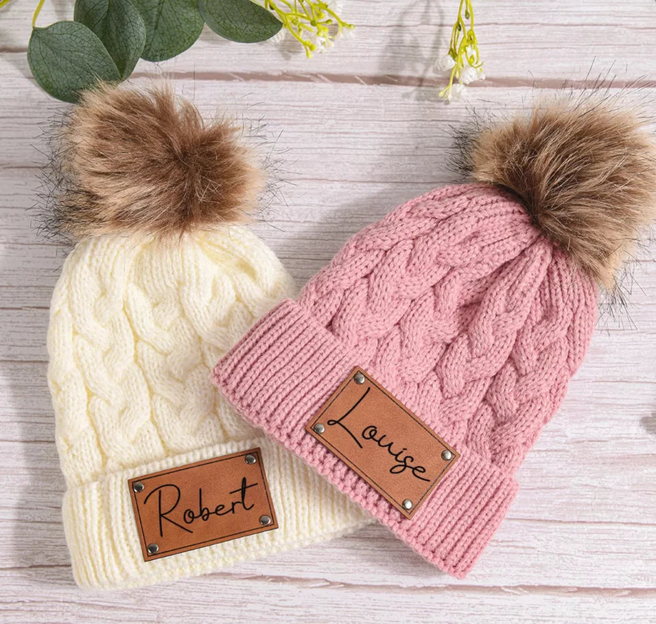 Soft knit personalized baby hat with a fluffy pom pom, warm and stylish infant apparel