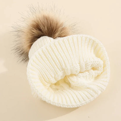 Warm pink knit hat with a large pom pom, personalized for a baby or toddler girl