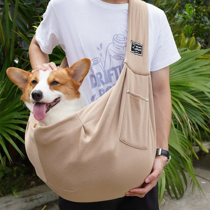 Stylish & secure pet sling carrier for small dogs and cats. Breathable mesh, adjustable for easy pet travel.