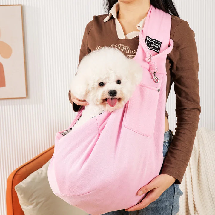 Convenient puppy & kitten carrier sling with adjustable shoulder strap for on-the-go pet owners.