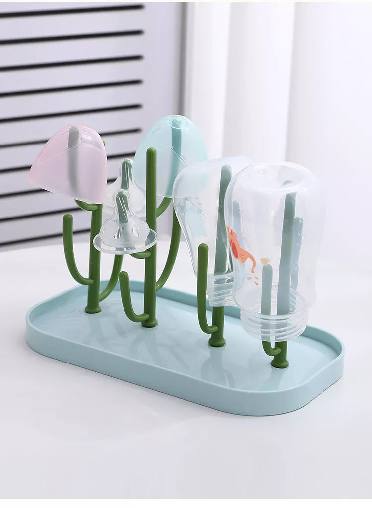 Pink baby feeding organizer, sleek design, showcasing capacity for multiple bottles and pump parts.
