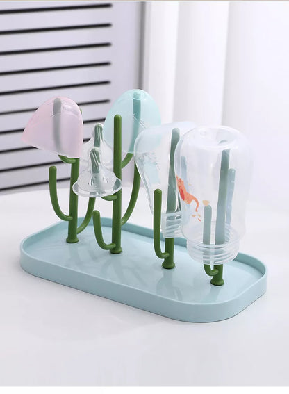 Pink baby feeding organizer, sleek design, showcasing capacity for multiple bottles and pump parts.