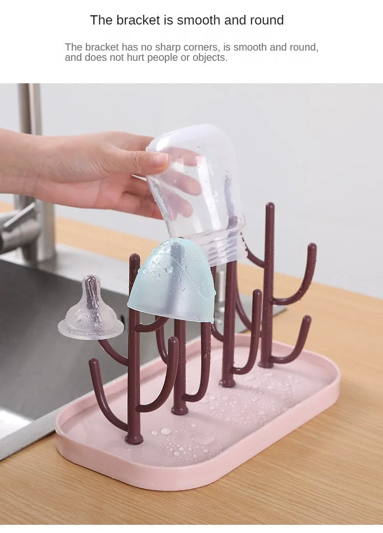 Beige baby bottle drying rack with different baby items, illustrating versatile drying options.