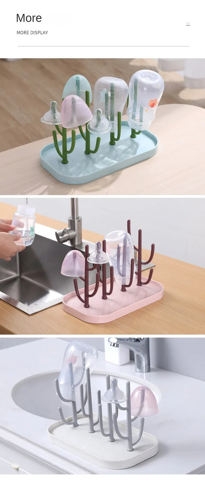 Pink baby bottle drying rack with water draining tray, ensuring no water accumulation on counter.