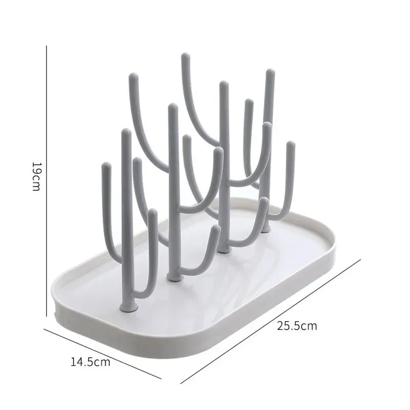 Beige baby bottle drying rack, space-saving design, holding various size baby bottles and nipples.