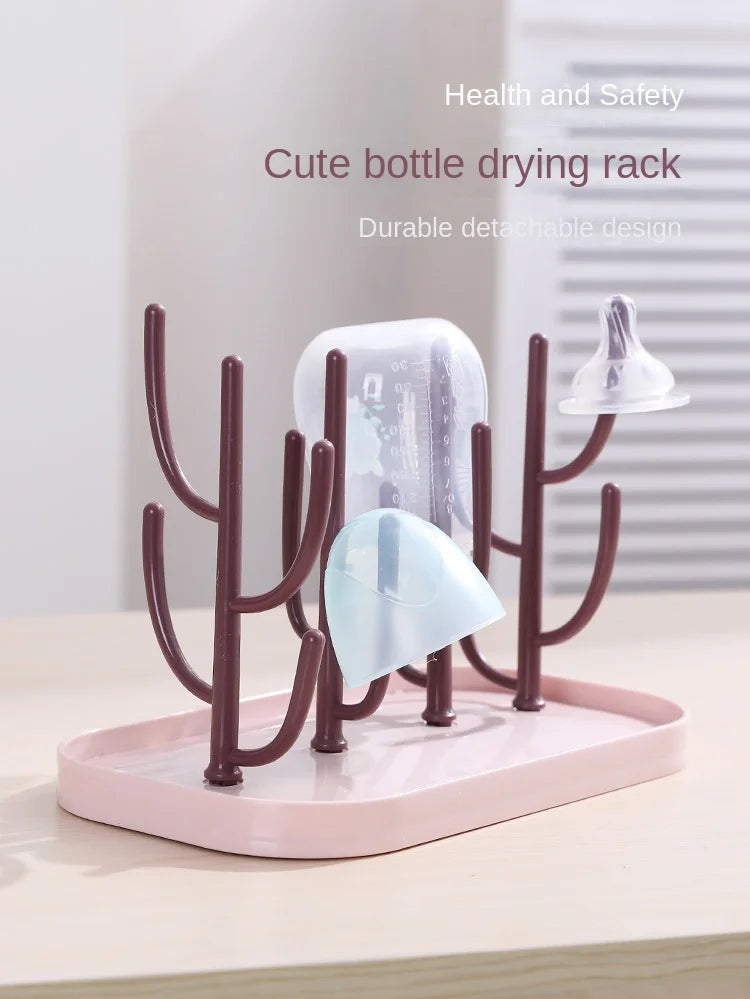 Beige baby bottle drying rack on a kitchen island, blending seamlessly with modern decor, for baby care.