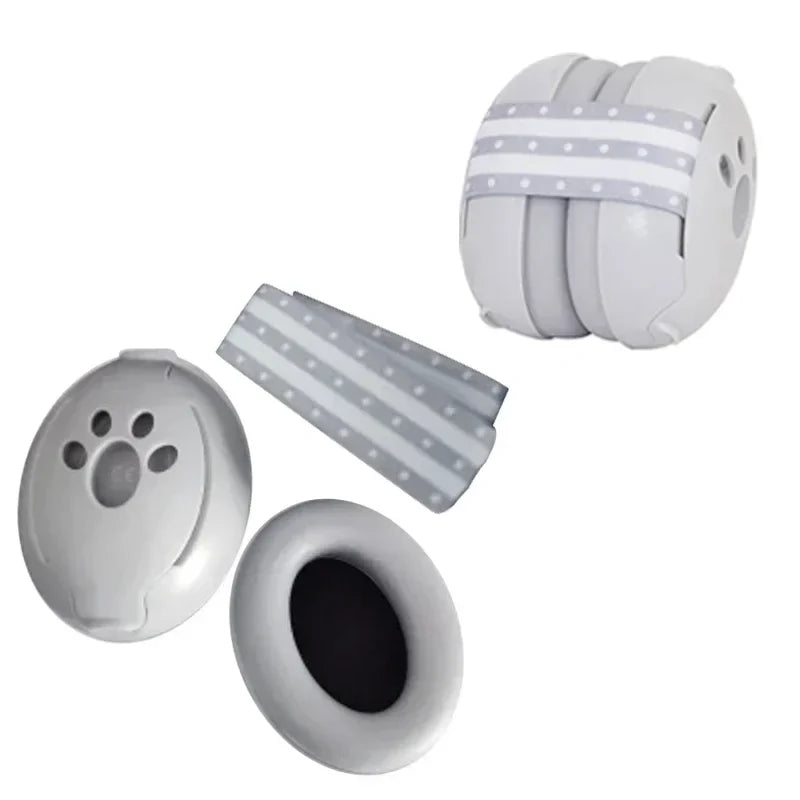 A baby wearing pink noise-canceling earmuffs, sleeping peacefully; soft hearing protection for infants.