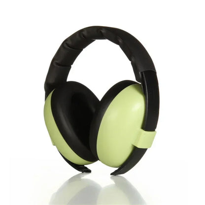 Pink baby noise-canceling earmuffs on a wooden surface, ready for infant and toddler use, adjustable.