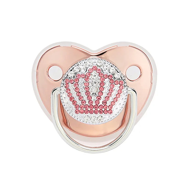 Baby holding a BPA-free silicone pacifier, providing gentle teething relief