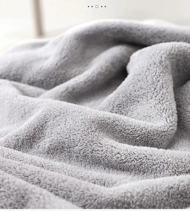 Gray elephant hooded baby towel next to baby wash, essential cotton for bathing
