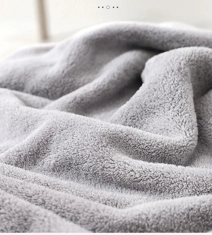 Gray elephant hooded baby towel next to baby wash, essential cotton for bathing