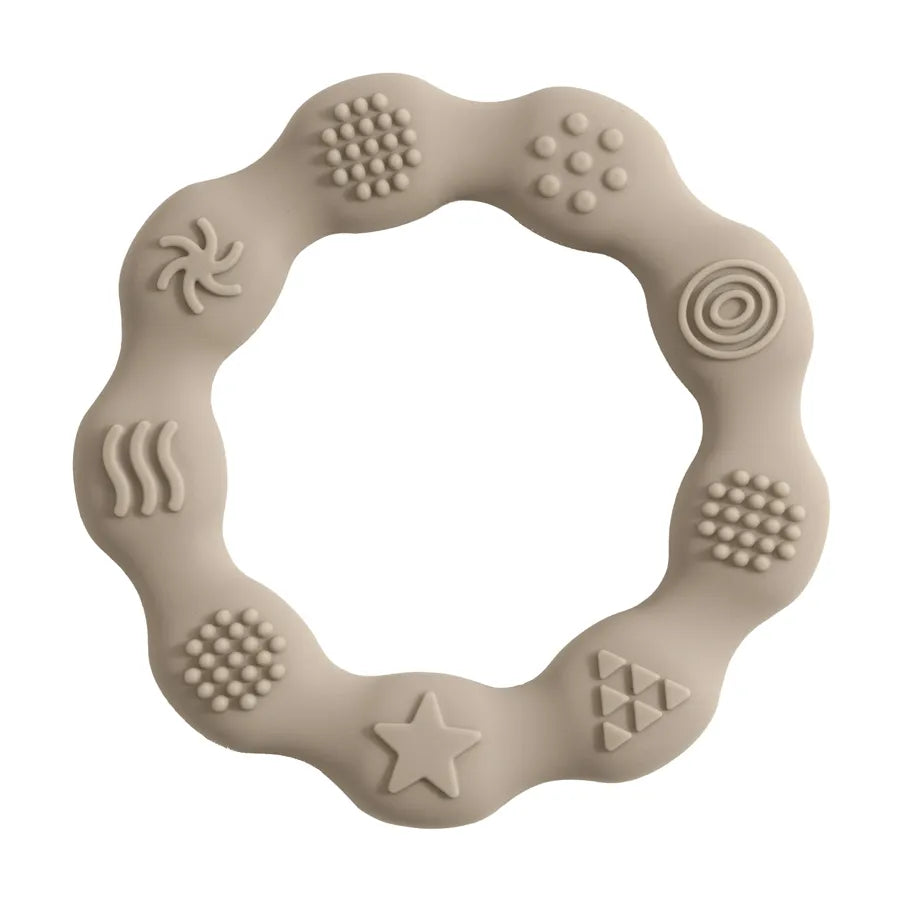 White silicone baby teether, soft and BPA-free, essential for newborn oral development