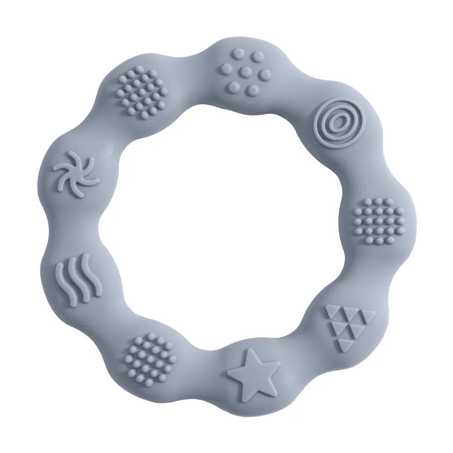 Detailed shot of a transparent silicone baby teether, BPA-free, aiding oral development