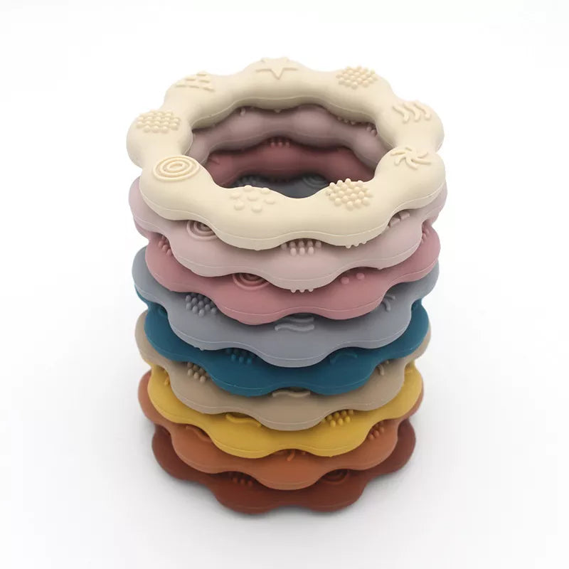 Close-up of a blue BPA-free silicone teether, a molar toy for baby comfort and teething relief