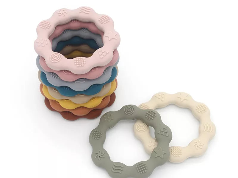 Silicone fruit-shaped teether in red, BPA-free, a fun molar toy for infant teething relief