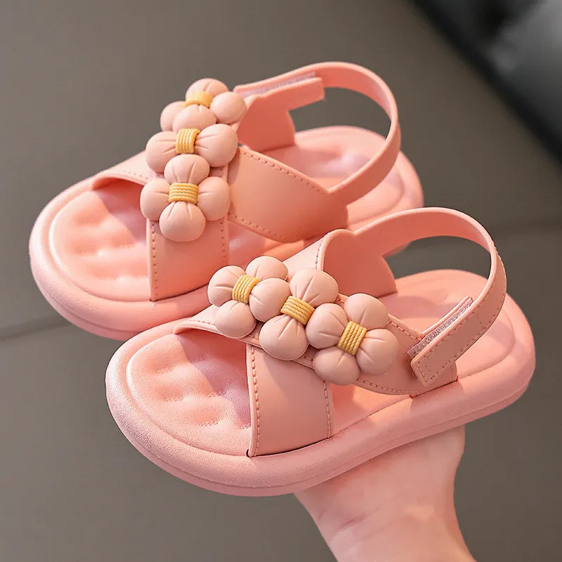 Pink girls' platform sandals with flower embellishments, stylish summer flat shoes for toddlers.