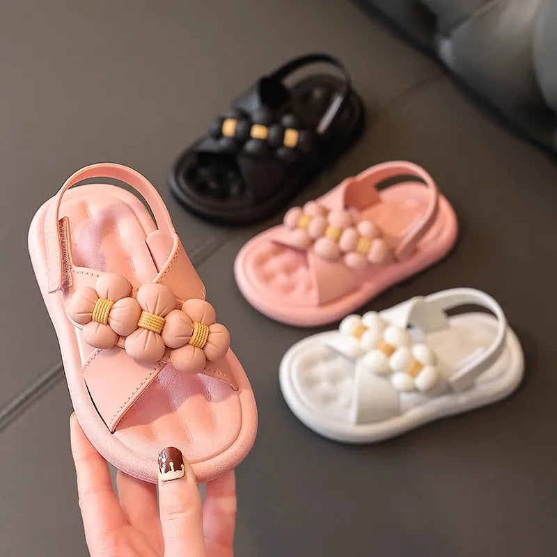 Girls' flower platform sandals in pink, perfect summer shoes for young children.