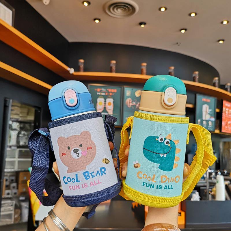 Pink insulated kids water bottle with straw, portable strap, and cartoon design, BPA-free